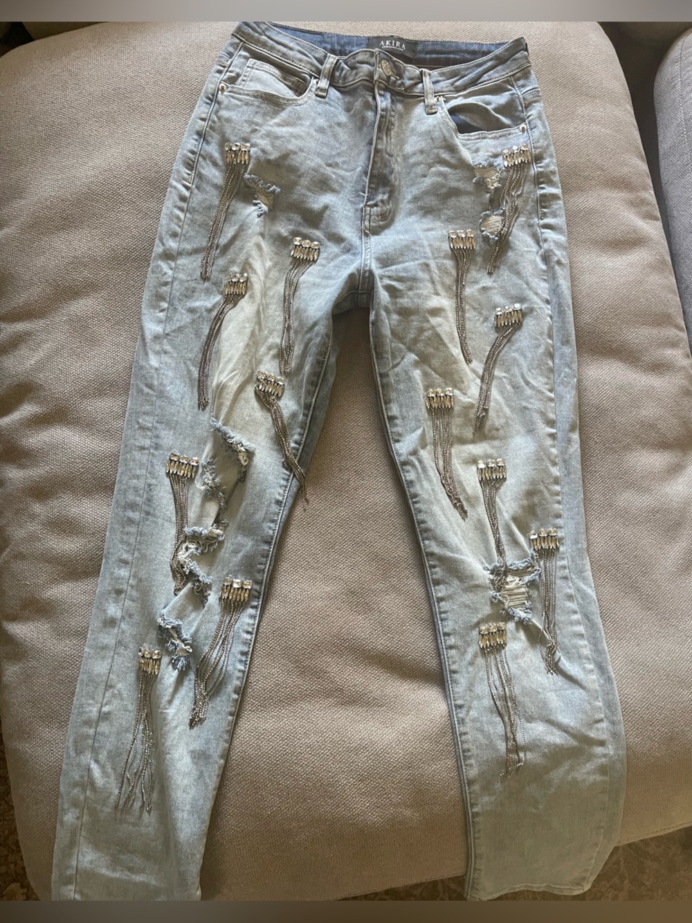 AKIRA Light Wash Skinny Jeans with Beaded Tassel Accents